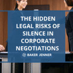 Four professionals in business attire sit and stand around a conference table, engaged in discussion. Overlaid text reads: The hidden legal risks of silence in corporate negotiations. Baker Jenner.