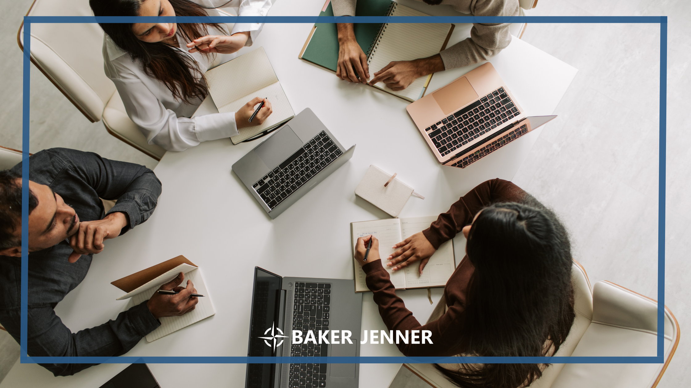 Four people sit around a table with laptops and notebooks, taking notes and having a discussion. The image includes the Baker Jenner logo at the bottom center.